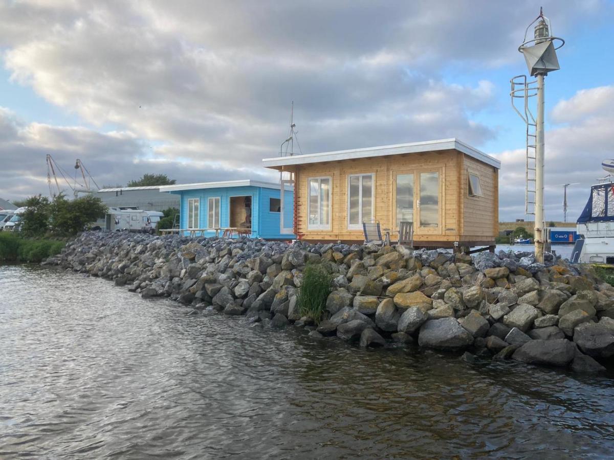 Waterhuisjes Op De Pier Van Lauwersmeerplezier! เลาเวอร์ชูก ภายนอก รูปภาพ